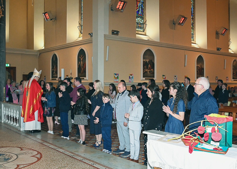 Bishop Fintan Gavin, Bishop of Cork and Ross Confirming children at Barryroe. Photo: Martin Walsh.