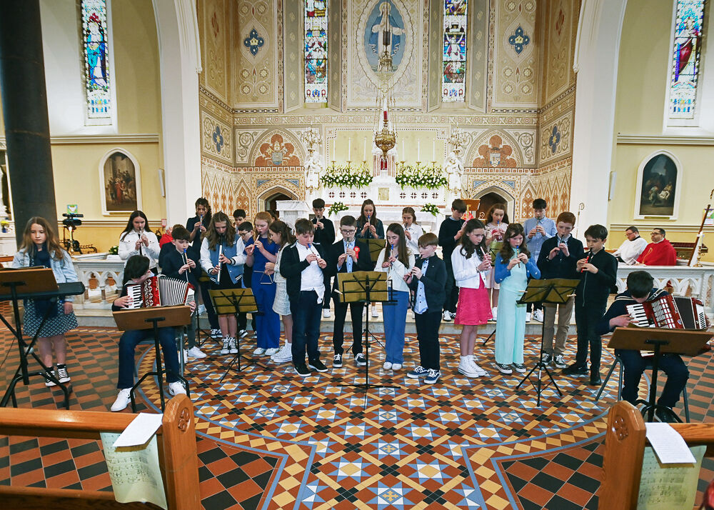 Confirmation candidates play music as a reflection. Photo: Martin Walsh.